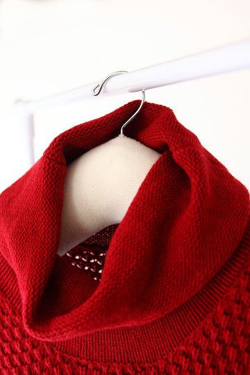 Hangerbee Padded Clothing Hangers hanging a red, cowl-neck sweater. Our Museum quality hangers are perfect for the long term storage and preservation of garments of all sizes.
